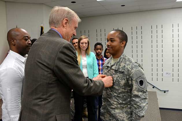 Bruce Rauner, Pfc. Justin Malone