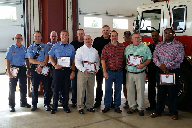 Ron Irons with State Farm workers and emergency responders