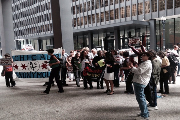 Protesters flock U.S. Sen. Dick Durbin's Chicago office Thursday. (John Gregory/Illinois Radio Network)