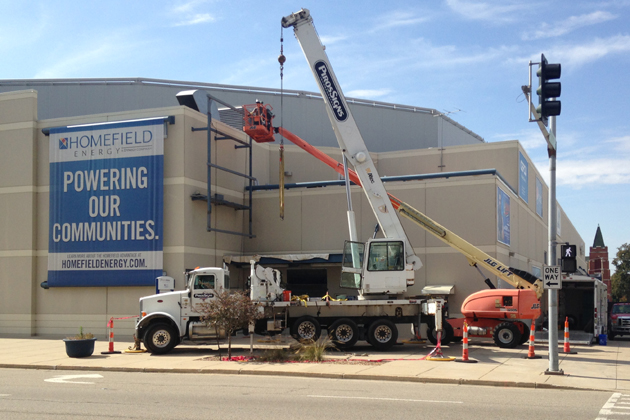 Construction crews work on installing the new marquee video board outside the U.S. Cellular Coliseum (Photo by Joe Ragusa/WJBC)