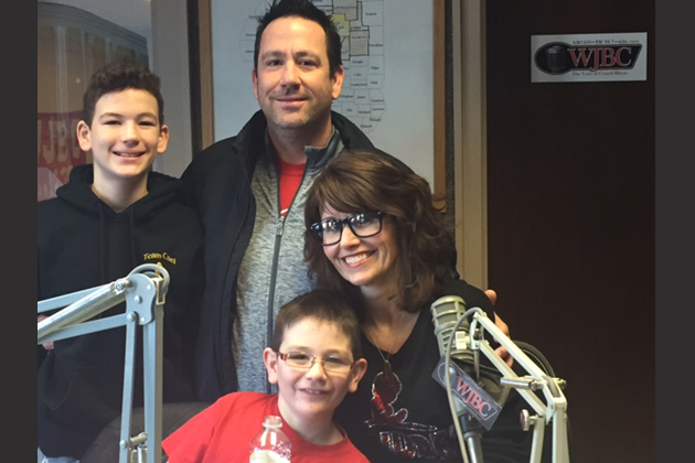 The Wolfe family (Parents Bryan and Jamie, children Gage and Cael) spoke with WJBC's Scott Laughlin during the Radio Bloomington St. Jude Radiothon Thursday. (Colleen Reynolds/WJBC)
